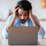 frustrated-man-on-laptop-is-miserable-at-work